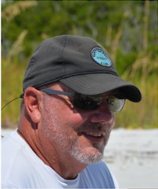 Captain Paul O'Neill in a ball cap and sunglasses