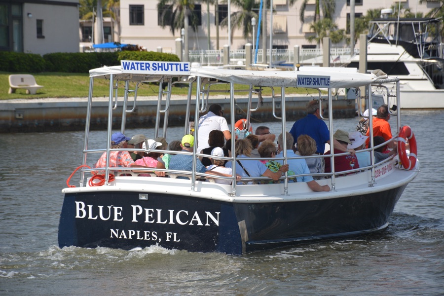 A Sand Dollar boat on protected Naples Bay near the 5th Avenue South waterfront in Naples, Florida